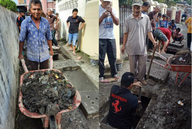 Warga Bukittinggi goro membersihkan got dan saluran air